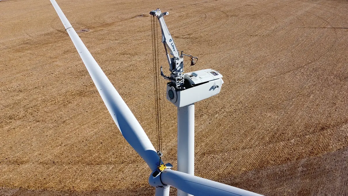 The Liftra Self-Hoisting Crane lowers rotor on GE 2.X turbine in USA.